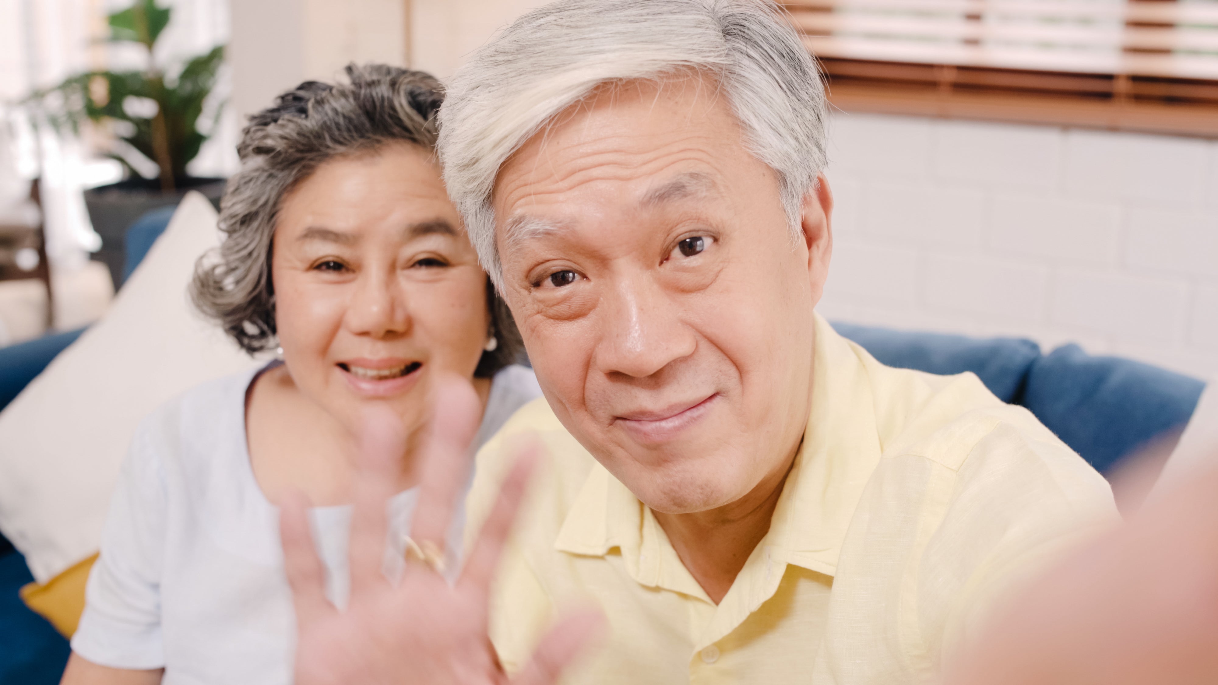 files/asian-elderly-couple-using-smartphone-video-conference-with-grandchild-while-lying-sofa-living-room-home.jpg